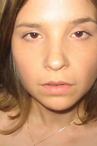 sensuous bare woman on bed, sultry posture